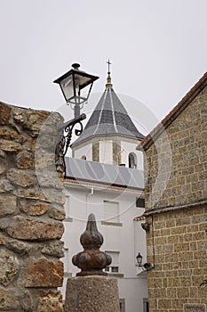 Tower and lamppost in the Sanctuary of Nuestra SeÃÂ±ora del CastaÃÂ±ar, in Bejar, Salamanca, Castilla Leon, Spain. photo