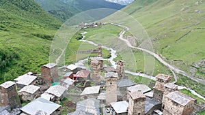 Tower of Lower Chazhash Castle and Ushguli village at the foot of Mt. Shkhara. Picturesque and gorgeous scene. Rock