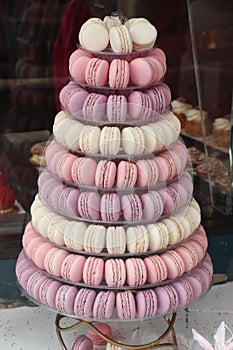 Tower of macarons in white, purple and pink