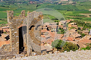 Tower of Montalcino Fortress and town rooftops in Val d`Orcia, T