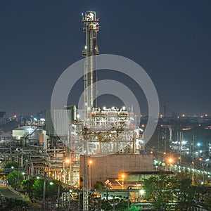 Tower of oil refinery at twilight