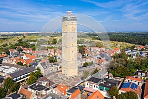 The tower of old Brandaris lighthouse among historical houses around the central square of West-Terschelling town. Terschelling photo