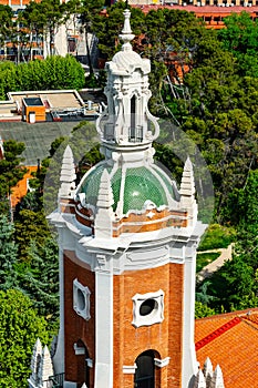 Tower of an old church in the city of Madrid next to the entrance of the Moncloa to the city. photo