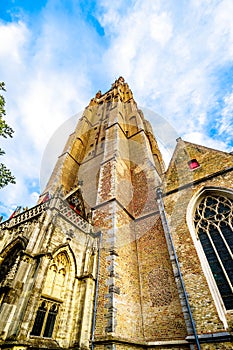 The tower of Onze Lieve Vrouwekerk Church of Our Lady in the medieval city of Bruges, Belgium