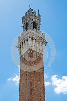 Tower of Palazzo Pubblico on Piazza del Campo in historic city centre of Siena, Italy, Europe photo