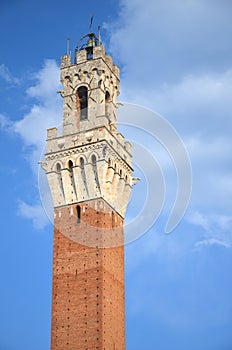 The tower of Palazzo Pubblico on Piazza del Campo in Siena, Italy