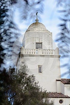 Tower of Presidio park framed by leaves