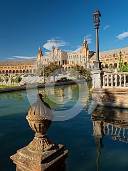 Tower reflected in the water of the Plaza EspaÃ±a in Seville