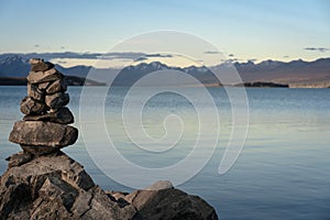 Tower of rock balancing above the Lake Tekapo located in New Zealand