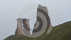 Tower Shchitovka and the church tower. Ruins of Mindovg Castle on Castle Hill. Novogrudok. Belarus. Autumn