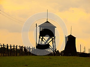 Tower silhouettes of concentration camp