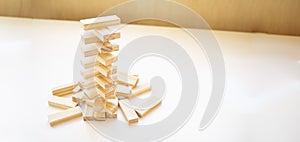 The tower stack from wooden blocks toy with sky background. Learning and development concept