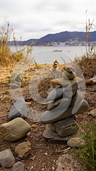 Tower of stones in cala bramant in Llanca photo