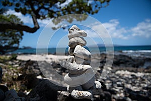 Tower of stones on sea beach background. Relaxing in the tropical beach, with stack of stones.