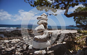 Tower of stones on sea beach background. Relaxing in the tropical beach, with stack of stones.