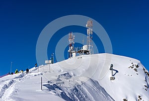 Tower with telecommunications equipment and meteorological station