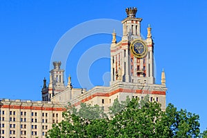 Tower with thermometer of Lomonosov Moscow State University MSU against blue sky photo