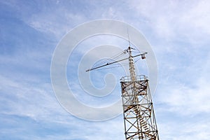 A tower for training parachute jumping against the background of the sky