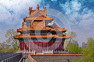 Tower on the walls of the Palace Museum, known also as the Forbidden City, in Beijing with red walls and orange roofs