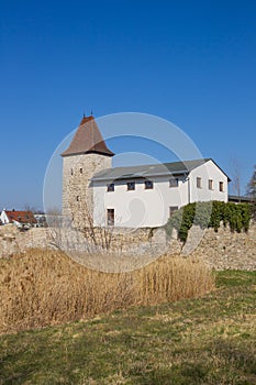 Tower and white house at the city wall of Stassfurt