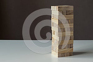 Tower from wooden blocks. Jenga board game photo