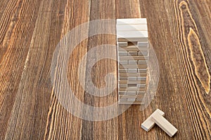 The tower of wooden blocks placed on a table.