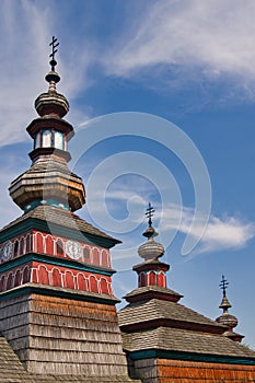 Tower of wooden church in open air musem near Bardejovske kupele spa resort during summer