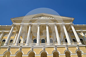 Towering columns and a portico at the entrance to the Russian Mu