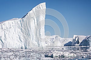 Towering great icebergs in the Ilulissat Icefjord in Greenland