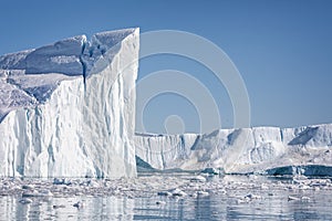 Towering great icebergs in the Ilulissat Icefjord in Greenland