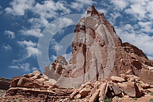 A towering pyramid shaped rock formation, made of Entrada Sandstone, in Arches National Park, Moab, Utah
