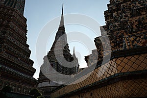 The towers of the ancient Buddhist monastery are decorated with colorful patterns