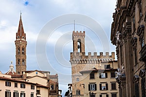 Towers Badia Fiorentina and bargello over houses