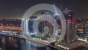 Towers at the Business Bay aerial night timelapse in Dubai, United Arab Emirates