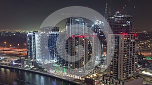 Towers at the Business Bay aerial night timelapse in Dubai, United Arab Emirates