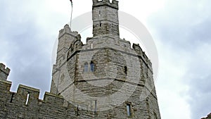 The towers of Caernarfon Castle in the rain , often anglicized as Carnarvon Castle, is a medieval fortress in Caernarfon
