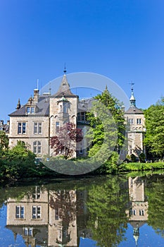 Towers of Castle Buckeburg with reflection in the water