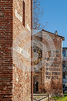 The towers of the city walls of Cascina, Pisa, Italy, with the exhortation to look higher