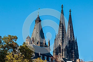 The towers of Cologne Cathedral and the historic town hall in the old town