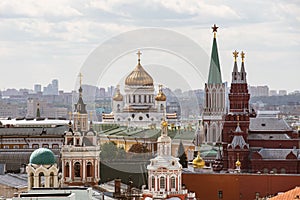 Towers and domes of Moscow  downtown: Kremlin tower and Cathedral of Christ the Savior at sunny day. Symbols of Moscow, Russia