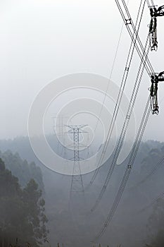 Towers of eletric power transmission in fog