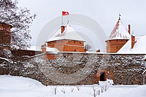 Towers of historical Trakai castle covered with snow, Lithuania. Winter landscape