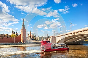 Towers of the Kremlin and a pleasure ship on the Moskva River in Moscow