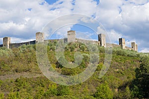 Towers of medieval fortress of Monteridzhioni in the September afternoon. Tuscany, Italy