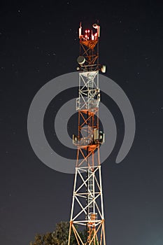 Towers for mobile communication systems 4g and 5g on the background of the starry sky