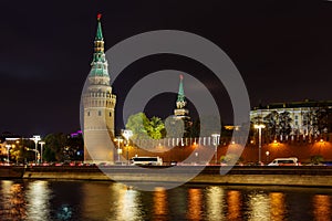 Towers of Moscow Kremlin on a background of Kremlevskaya embankment of Moskva river. Night landscape of Moscow historical center