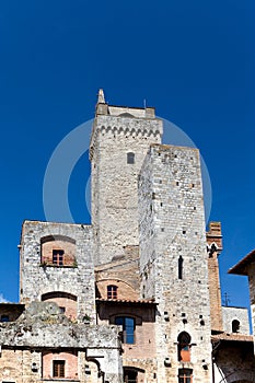 Towers on Piazza della Cisterna in San Gimignano in tuscany in italy