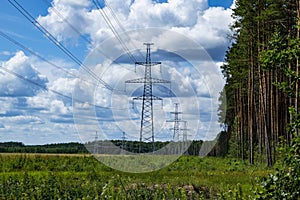 The towers of the power line of energy against the background of nature.