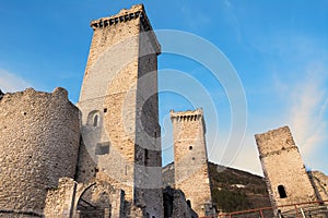 Towers and rampart of Pacentro castle at sunset Italy