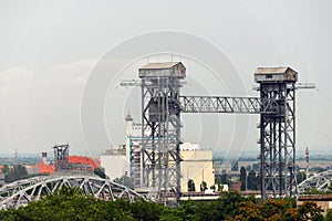 Towers of a rising steel bridge. industrial landscape